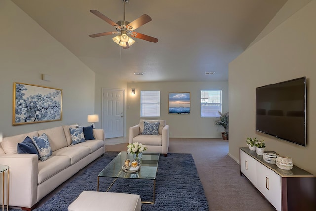 living room featuring ceiling fan, lofted ceiling, and dark colored carpet