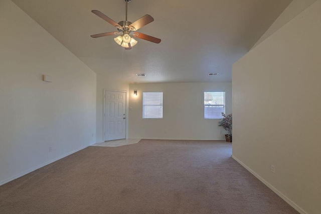 carpeted empty room featuring ceiling fan