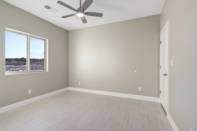 empty room featuring ceiling fan