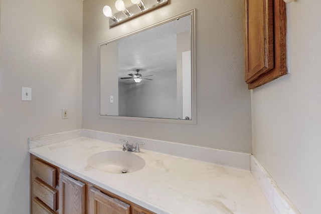 bathroom featuring ceiling fan and vanity