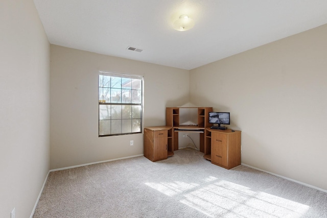 unfurnished office with light colored carpet