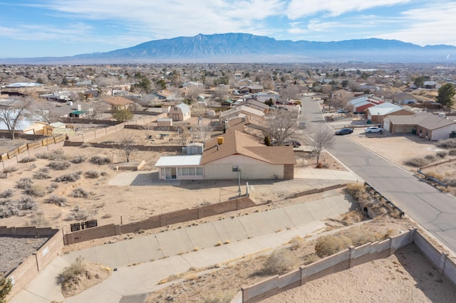 birds eye view of property with a mountain view