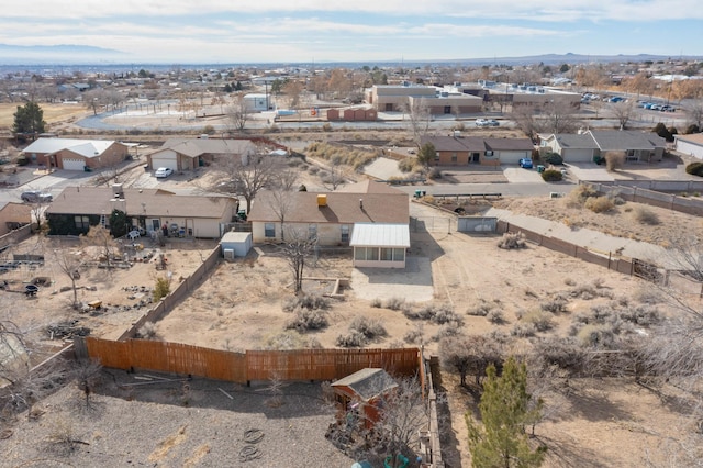 birds eye view of property with a mountain view