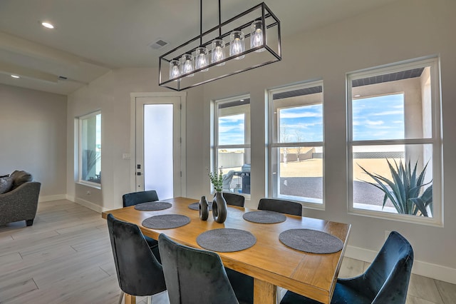 dining room with light hardwood / wood-style floors