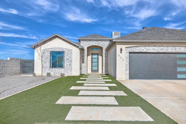 view of front facade featuring a front lawn and a garage