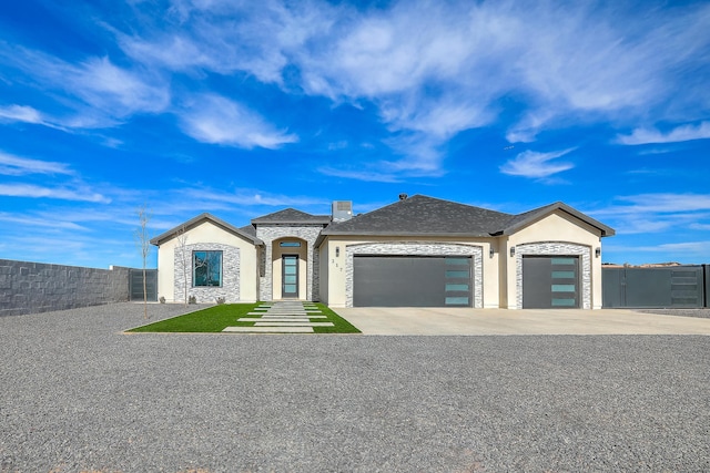 french country style house featuring a garage