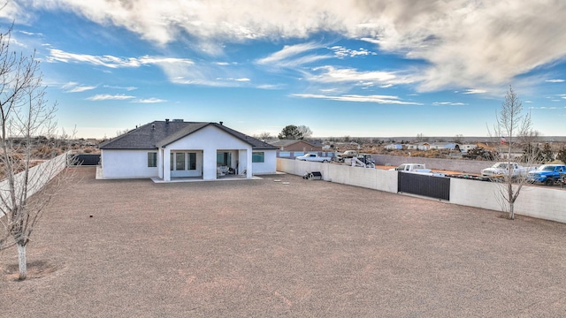 back of property featuring a patio area