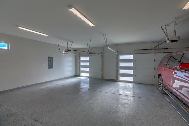 garage featuring electric panel and a garage door opener