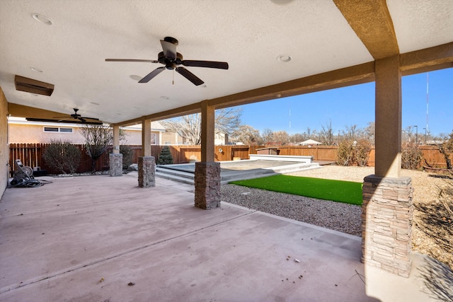 view of patio featuring ceiling fan