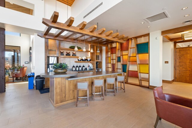 bar featuring hanging light fixtures