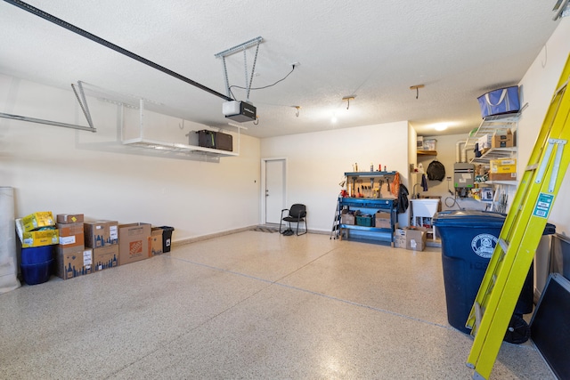 garage featuring a garage door opener and baseboards