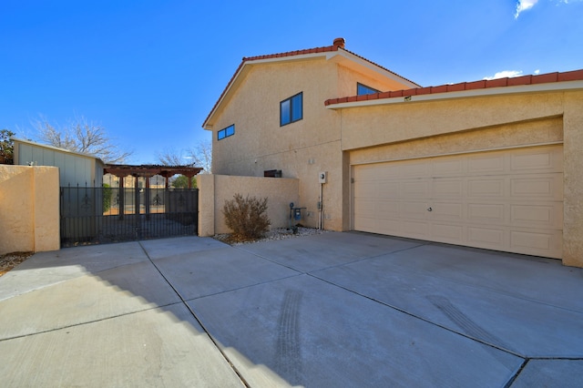 view of side of home with a garage