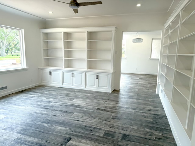 unfurnished room with dark hardwood / wood-style floors and ceiling fan