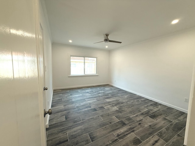 unfurnished room featuring dark wood-type flooring, ornamental molding, and ceiling fan