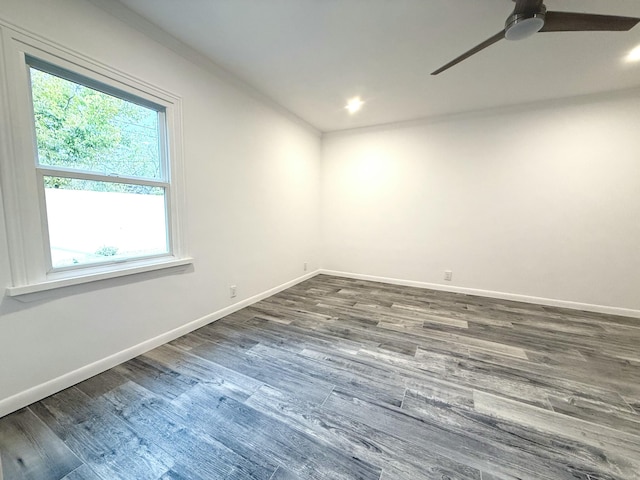 unfurnished room featuring dark hardwood / wood-style flooring and ceiling fan