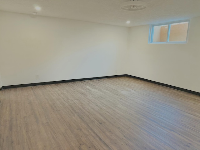 empty room with light hardwood / wood-style flooring