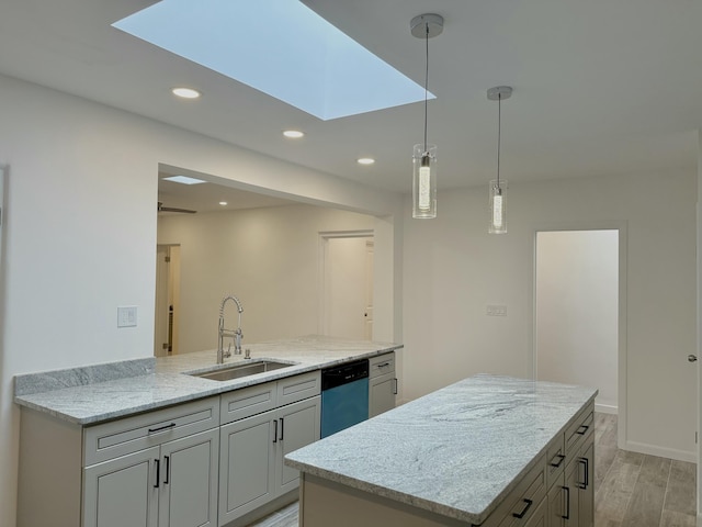 kitchen featuring pendant lighting, an island with sink, sink, stainless steel dishwasher, and light stone counters