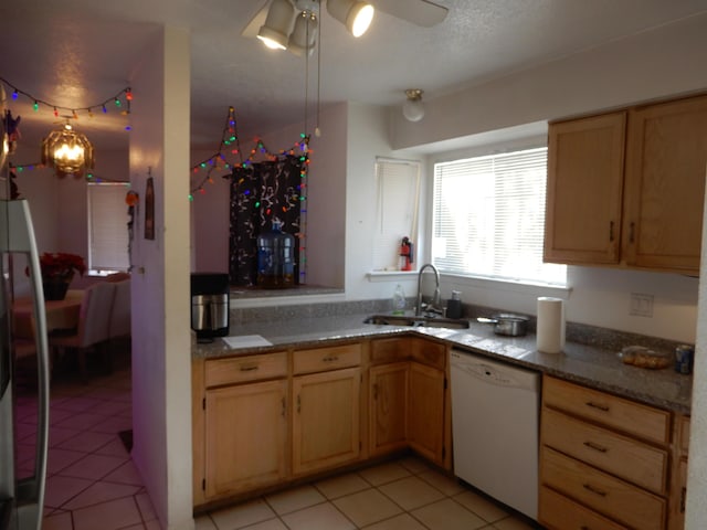 6456 Ja Ct NW, Albuquerque, NM 87120 - kitchen featuring white dishwasher, light brown cabinets, ceiling fan, light tile patterned floors, and freestanding refrigerator
