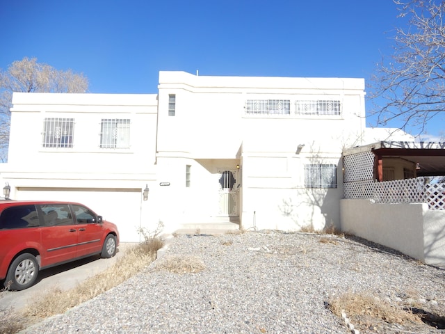6456 Ja Ct NW, Albuquerque, NM 87120 - art deco house with stucco siding and a garage