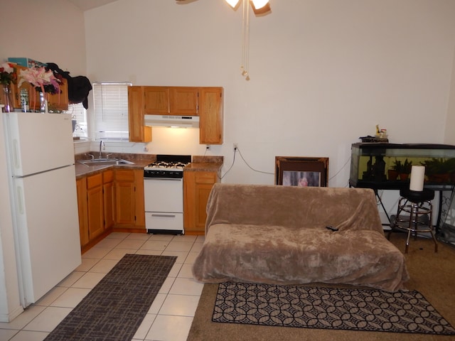 6456 Ja Ct NW, Albuquerque, NM 87120 - kitchen with white appliances, under cabinet range hood, a high ceiling, light tile patterned floors, and a ceiling fan