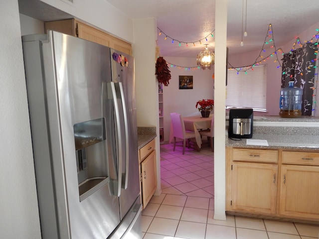 6456 Ja Ct NW, Albuquerque, NM 87120 - kitchen with stainless steel fridge, light brown cabinetry, light tile patterned floors, and light countertops