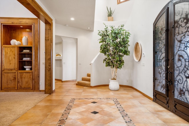 entryway with french doors, stairway, recessed lighting, and baseboards