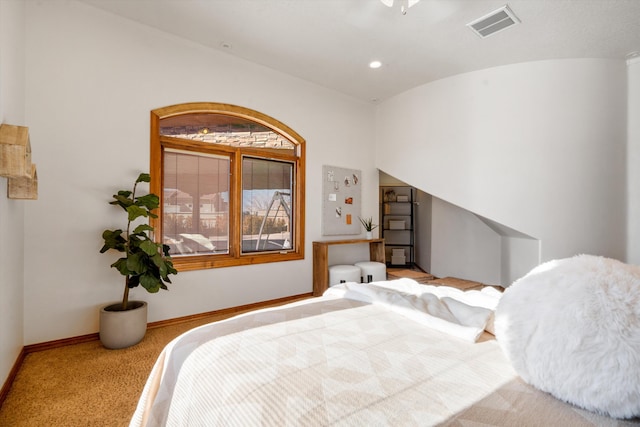 carpeted bedroom featuring baseboards, visible vents, and recessed lighting