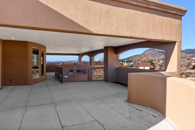 view of patio / terrace featuring a gate and a mountain view