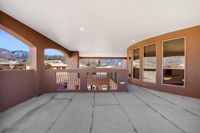 view of patio / terrace featuring a balcony and a mountain view