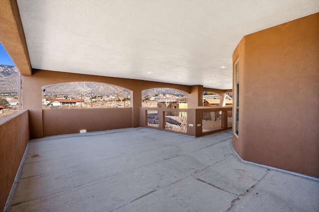 view of patio / terrace featuring a mountain view