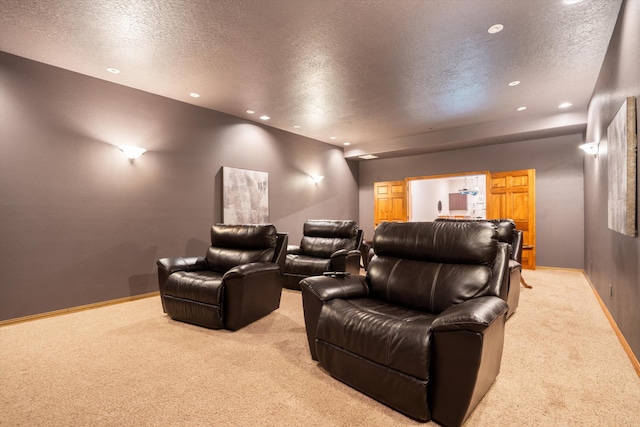 cinema with recessed lighting, light colored carpet, a textured ceiling, and baseboards