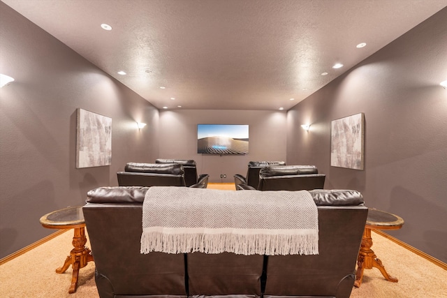 carpeted cinema with baseboards, a textured ceiling, and recessed lighting