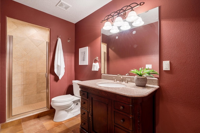 full bathroom with visible vents, toilet, a textured ceiling, a shower stall, and vanity