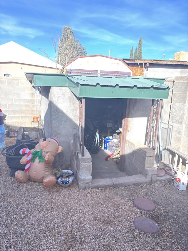 view of side of home with fence