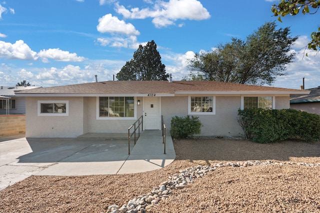 single story home featuring a patio area