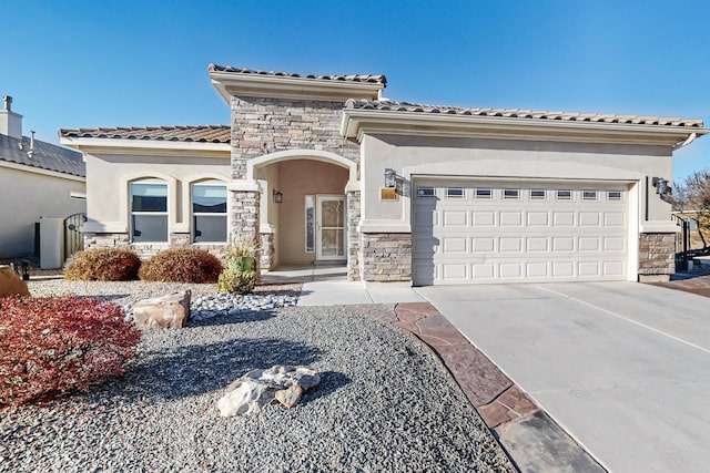 mediterranean / spanish house featuring a garage