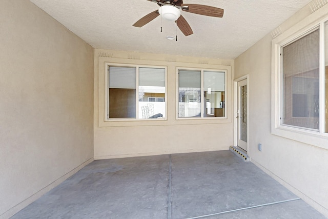 view of patio featuring ceiling fan