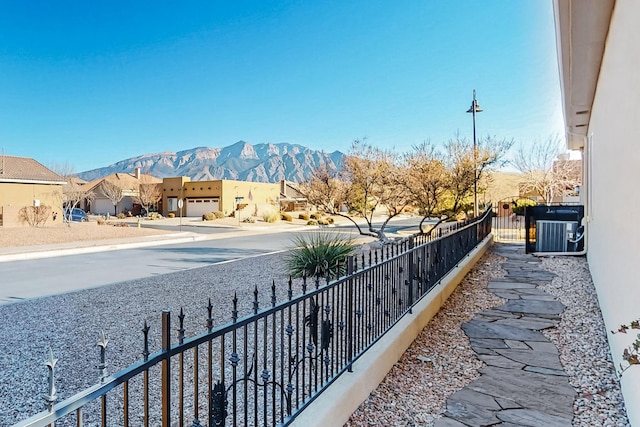 exterior space with a mountain view and central air condition unit