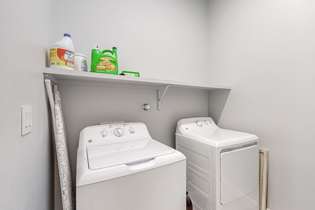 washroom with separate washer and dryer