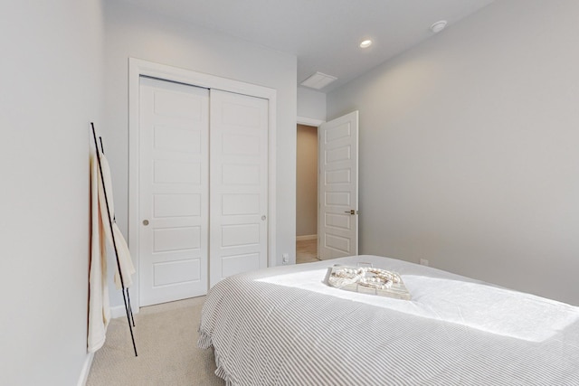 carpeted bedroom with a closet