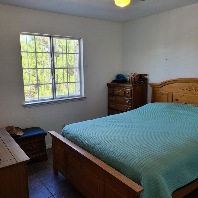 bedroom with dark tile patterned flooring