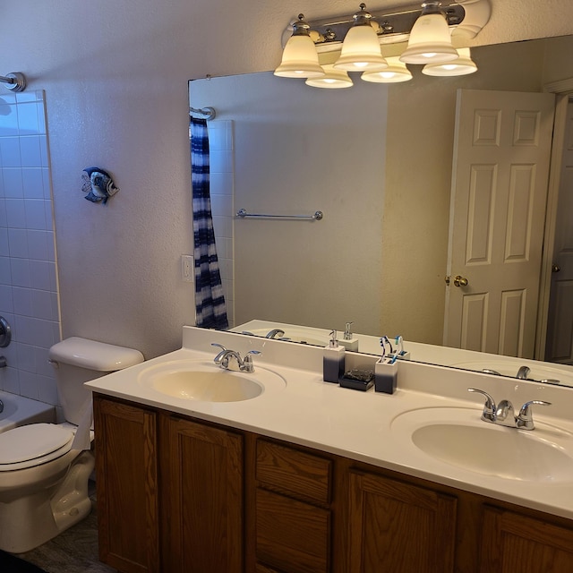 full bathroom with vanity, shower / bathtub combination with curtain, and toilet