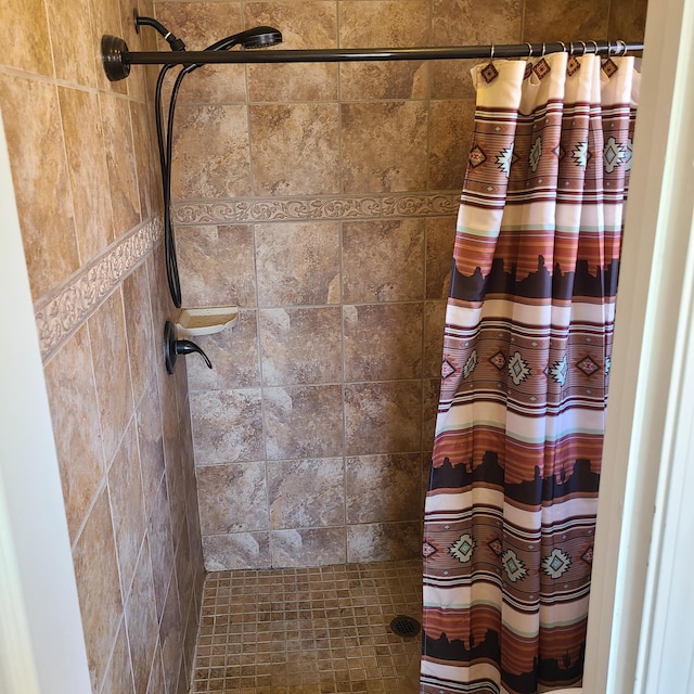 bathroom featuring a shower with curtain