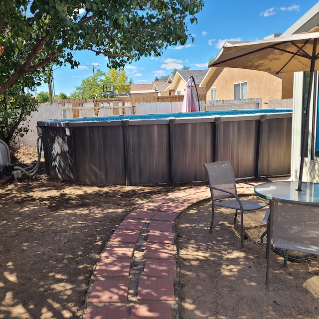 view of patio / terrace featuring a fenced in pool