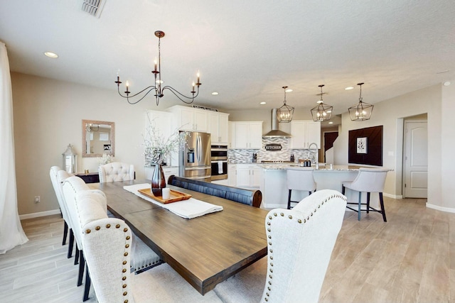 dining area featuring light wood-type flooring