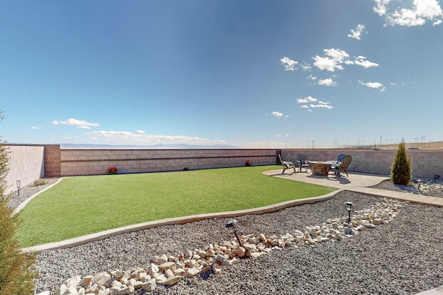 view of yard with a fire pit and a patio