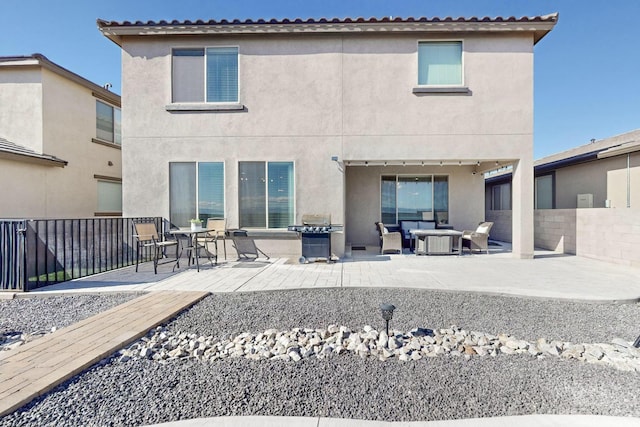 rear view of house featuring a patio