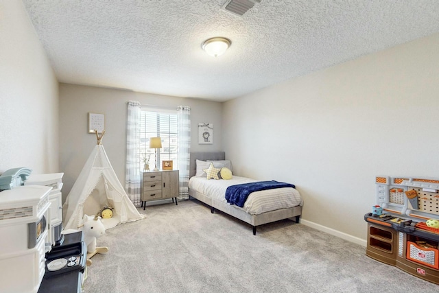 carpeted bedroom with a textured ceiling