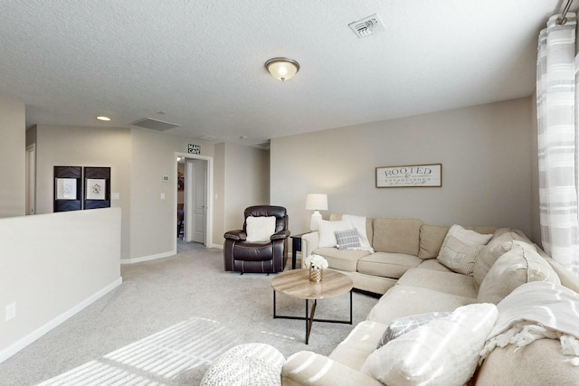 carpeted living room with a textured ceiling