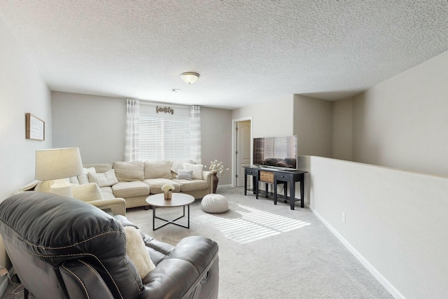 carpeted living room with a textured ceiling